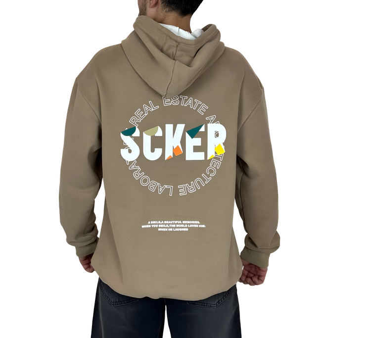 خرید هودی خاکی اورسایز گرافیکی SCKER - طرح چاپ پُشت - مناسب استایل یونیسکس